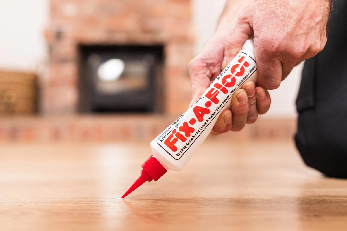 The  Fix-A-Floor Squeezy All-in-One Repair Adhesive for Loose, White