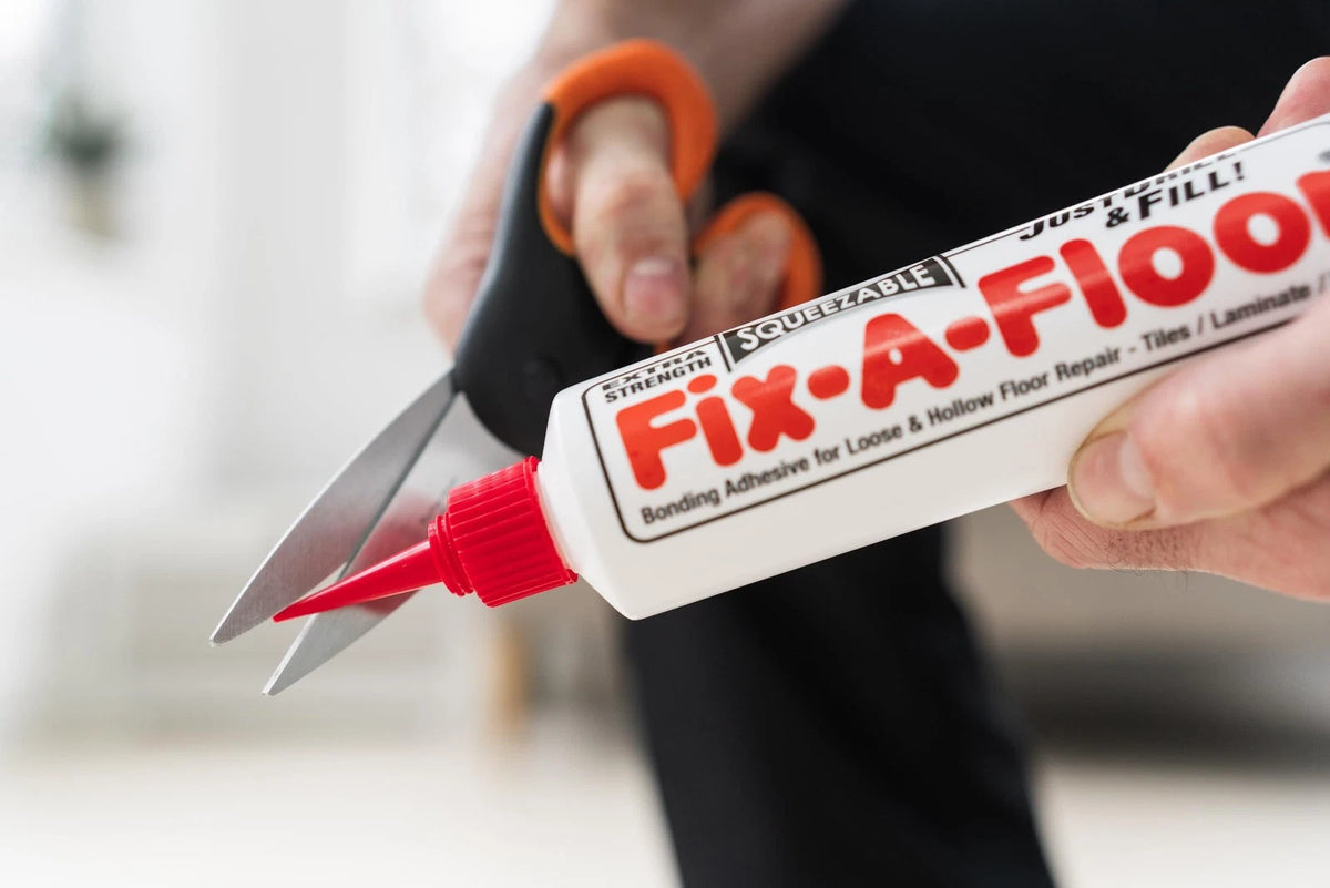 The  Fix-A-Floor Squeezy All-in-One Repair Adhesive for Loose, White